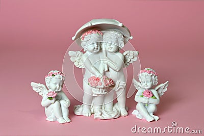 Little angels holding flowers Stock Photo