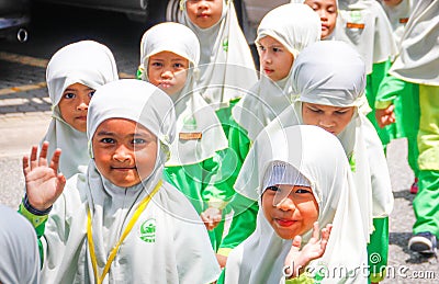 A group of little Asian girls from elementary school in white hijabs Editorial Stock Photo