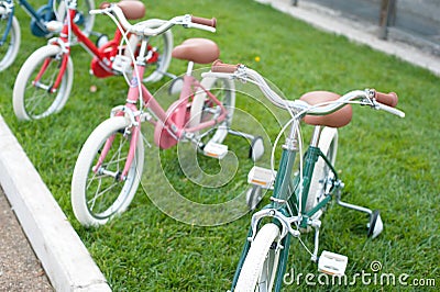 Group of little bicycle on grass Stock Photo
