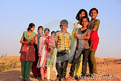 Group of local kids playing near water reservoir, Khichan village, India Editorial Stock Photo
