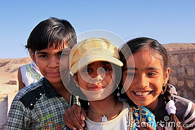 Group of local kids playing near water reservoir, Khichan village, India Editorial Stock Photo