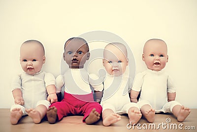 Group of lovely baby dolls sitting together Stock Photo