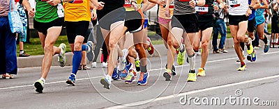 group male and female runners running marathon Stock Photo