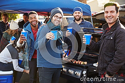 Group Of Male Sports Fans Tailgating In Stadium Car Park Stock Photo