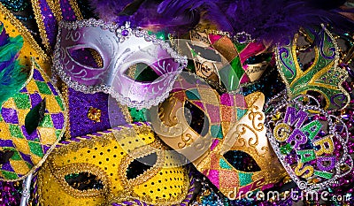 Group of Mardi Gras Mask on dark background with beads Stock Photo