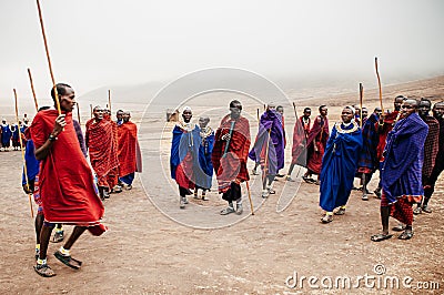Group Masai or Maasai tribe peoples in red and blue cloth dancing. Ethnic group of Ngorongoro Consevation, Serengeti in Tanzania Editorial Stock Photo