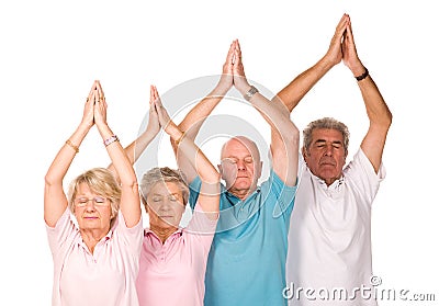 Group of mature people doing yoga Stock Photo