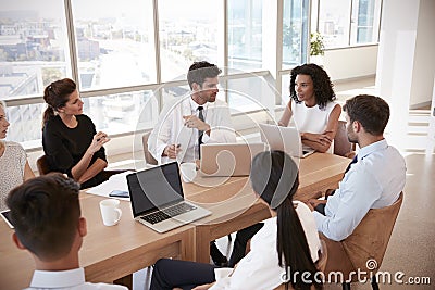 Group Of Medical Staff Meeting Around Table In Hospital Stock Photo