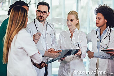 Group of medics discuss x-ray scan Stock Photo