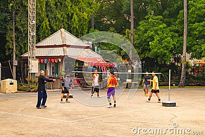 A group of men playing Sepak Takraw Editorial Stock Photo