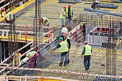 Group of men working at the construction site Editorial Stock Photo