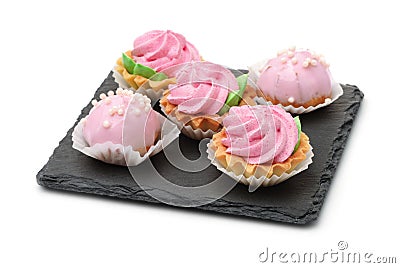 Group of mini cakes on slate plate Stock Photo