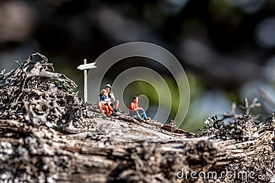 Group of miniature hikers having a break Stock Photo