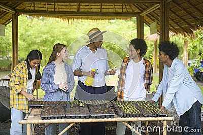 Group of mixed race students and teacher learning agriculture technology in smart farming , education ecology agricultural Stock Photo