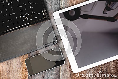 Group of modern electronic devices, computer laptop, digital tablet and mobile smart phone on wooden table. Clipping path tablet a Stock Photo