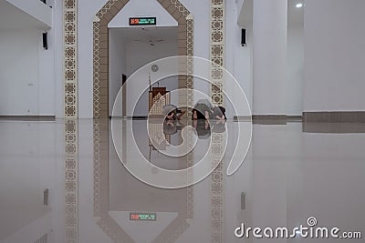 Group of moslem praying together in a mosque Editorial Stock Photo
