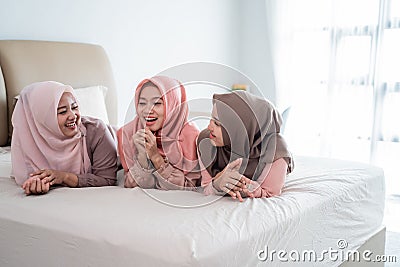 Group of moslem woman lying on the bed enjoy chatting together Stock Photo