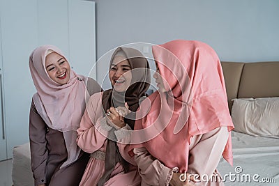 Group of moslem woman sitting on the bed enjoy chatting together Stock Photo