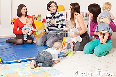 Group of mothers with their babies Stock Photo