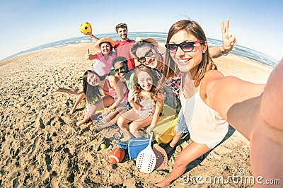 Group of multiracial happy friends taking fun selfie at beach Stock Photo