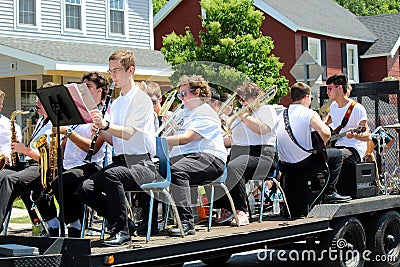 Several young people in band on wagon being drawn through town in All Things Oz Parade, Chittenango, New York, 2018 Editorial Stock Photo