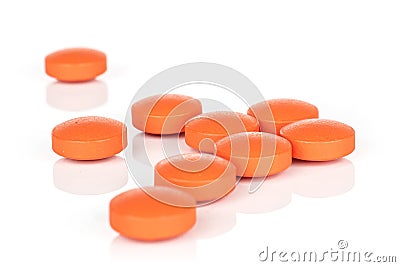 Orange pharmacy tablet isolated on white Stock Photo