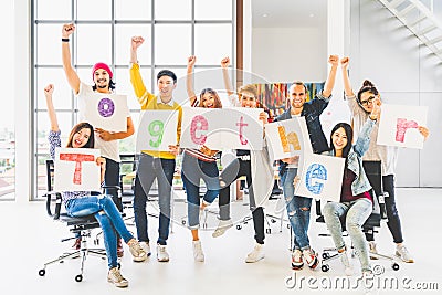 Group office coworker or creative people hold word together, cheer and celebrate. Business project partner, togetherness concept Stock Photo