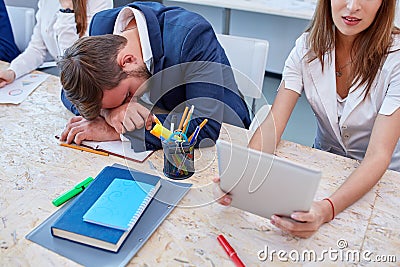 Office workers in the work process, the man fell asleep at the table. Stock Photo