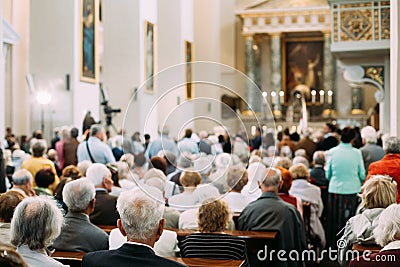 Group Of Old People Parishioners in Cathedral Church Editorial Stock Photo