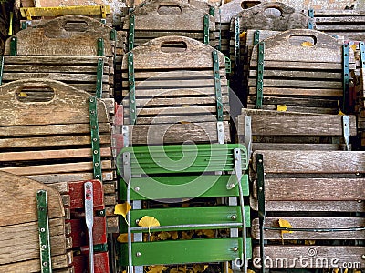 Group of old ruined folding wooden chairs closed Stock Photo