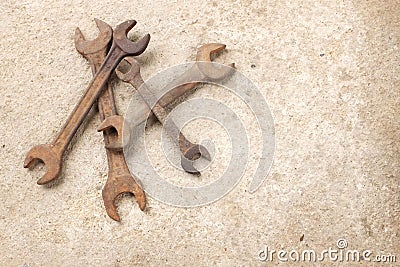 Copy space group old rusted spanner wrenches Mechanic tool on grey concrete background Stock Photo