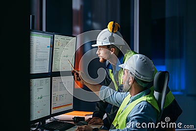 Group of operators control process on product line uses industry 4.0 and digital technology on modern factory Stock Photo