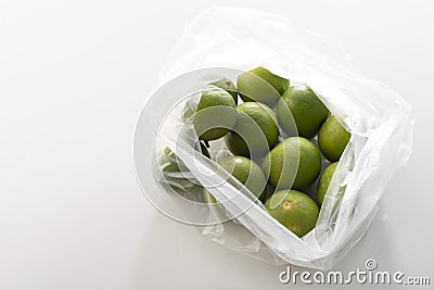 Group of organic fresh lime in plastic bag Stock Photo