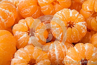 A group of peeled orange Clementine tangerines texture pattern b Stock Photo