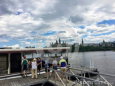 A group of people boarding the water taxi in Gatineau, Quebec to cross the Ottawa River Editorial Stock Photo