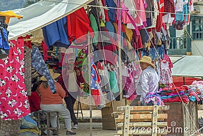 A group of people chating while waiting for costumers Editorial Stock Photo