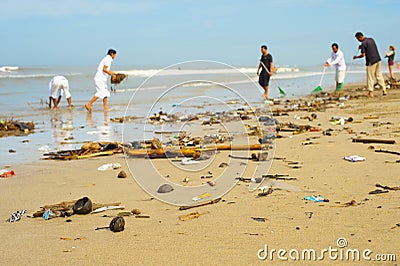 people cleaning ocean beach plastic Stock Photo