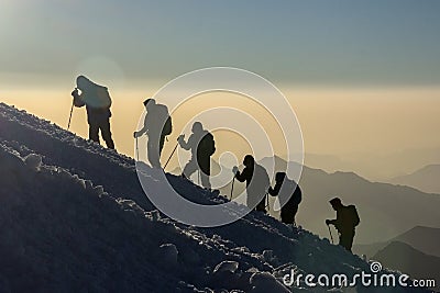 Group of people climbs the mountain Elbrus Stock Photo