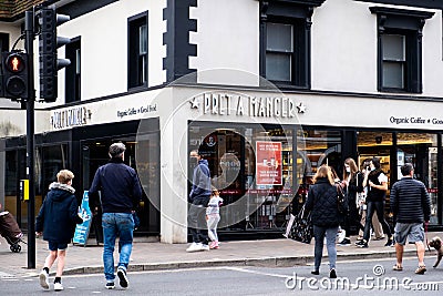 Group of People Crossing The Main Road Next To A High Street Pret A Manger Coffee Shop Editorial Stock Photo