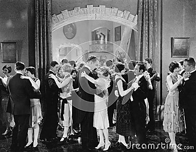 Group of people dancing in a ballroom Stock Photo