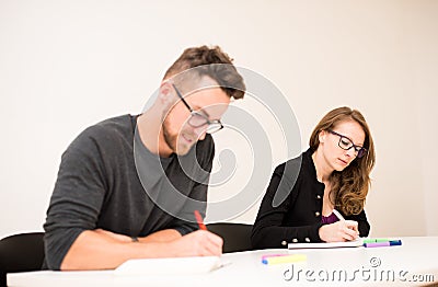 Group of people of different age sitting in classroom and attend Stock Photo