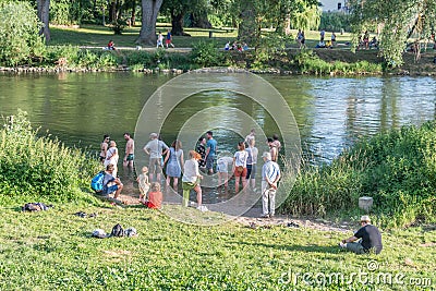 A group of people of different ages refreshing themselves in the Danube near Regensburg during the citizen festival 2019, Germany Editorial Stock Photo