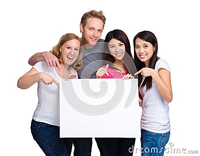 Group of people with diverse ethnicities holding blank sign for Stock Photo