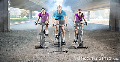 Group of people doing spinning on cycle bike Stock Photo