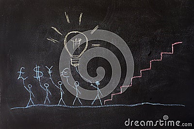 Group of people drawing on a school chalkboard. Stock Photo