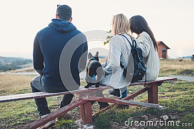 Group of people enjoying mounatin veiw with their dog Stock Photo