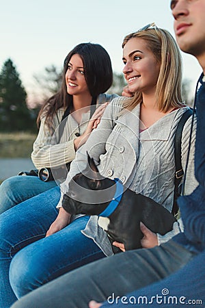 Group of people enjoying mounatin veiw with their dog Stock Photo