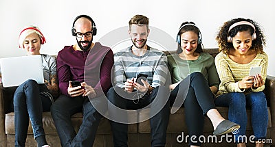 Group of people enjoying music streaming Stock Photo