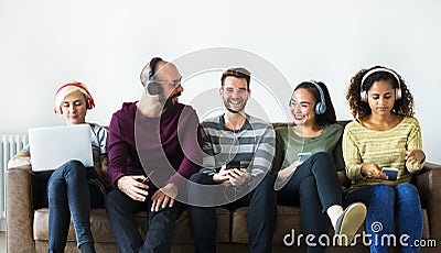 Group of people enjoying music streaming Stock Photo