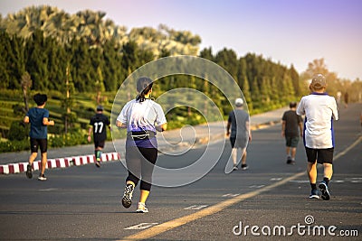 Group of people exercise walking in the park Editorial Stock Photo